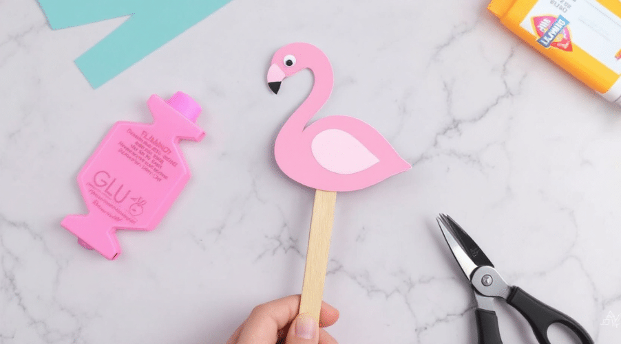 Flamingo design on a popsicle stick.