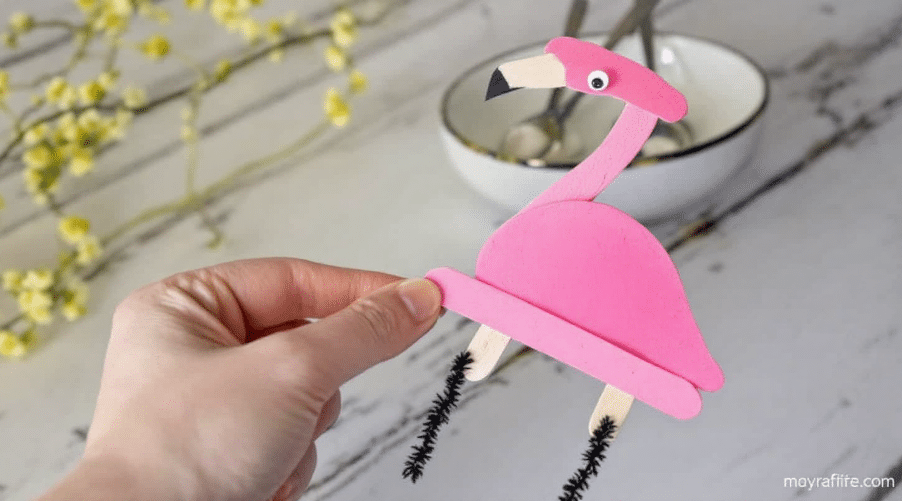 A pink popsicle stick flamingo design.