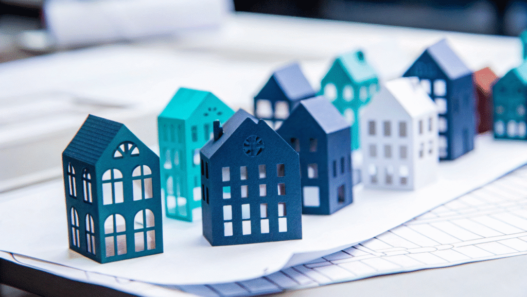3D paper buildings on a white background