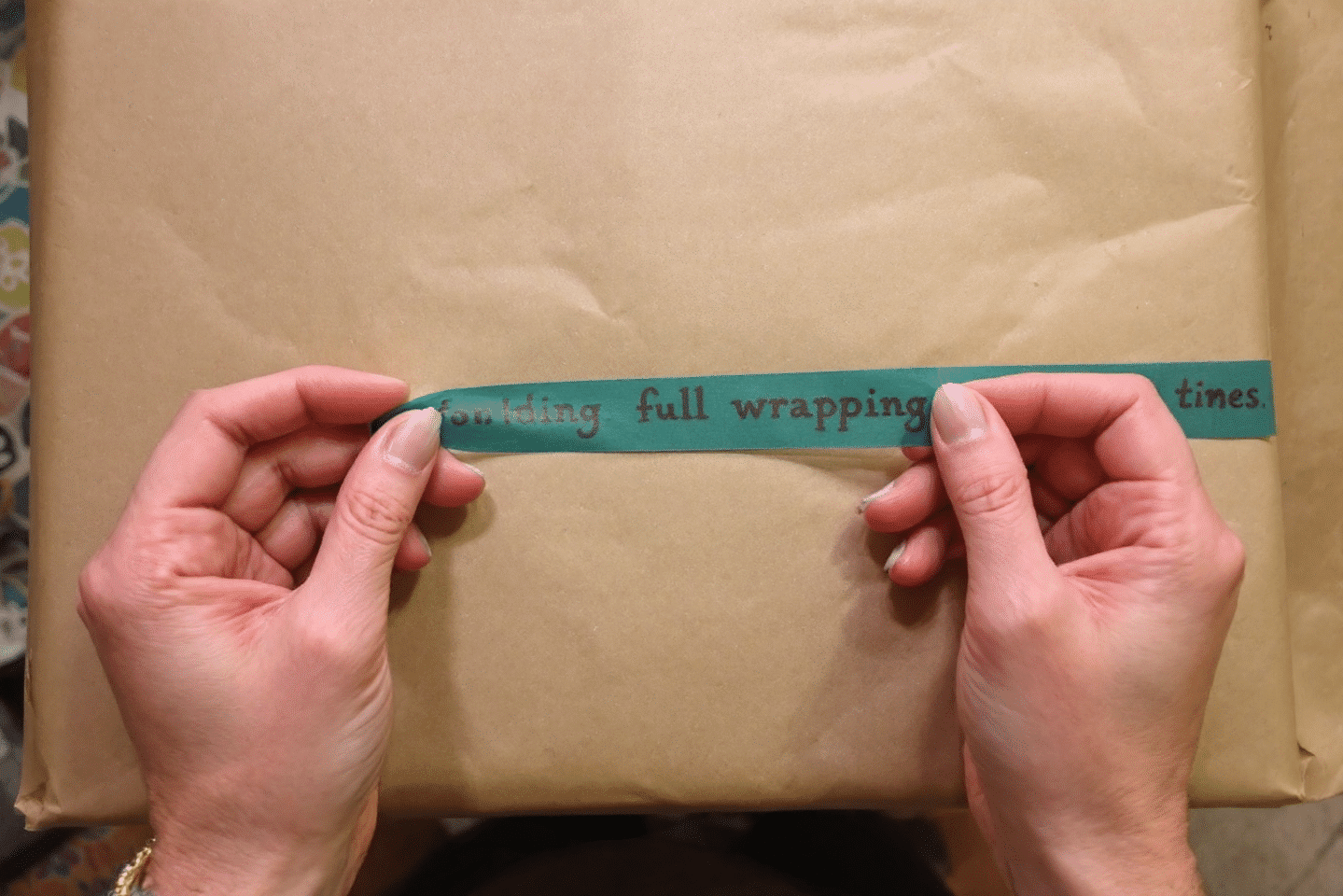A2fa461f37a34f3ca54408f35d67ac3d simply paper crafts A person holding a double sided tape on a blank wrapping paper