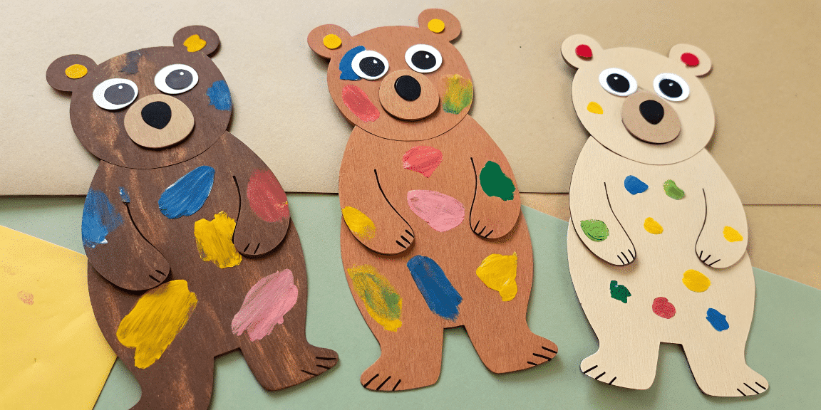 Ba38dceb3ce24c9a989b6ffb6abad9ec simply paper crafts A photo of a creative arts and crafts project featuring three wooden bear cutouts adorned with a variety of colors