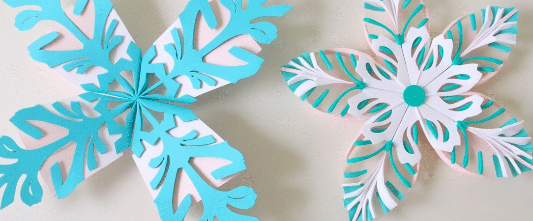 How to make paper snowflakes simply paper crafts Paper snowflakes on a light grey background