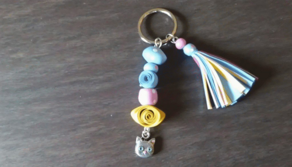 Image simply paper crafts In the image colorful paper bead keychains are displayed featuring a variety of pretty paper beads made from recycled magazine pages Each keychain is attached to a key ring and adorned with a cute charm or tassel showcasing creative paper bead jewelry ideas perfect for quick gifts