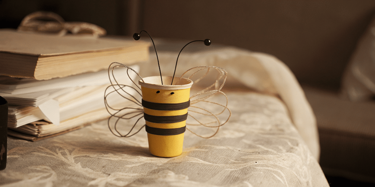 42944cc16c4940c397252133a319c516 simply paper crafts Paper cup made to look like a cute bee on a a table
