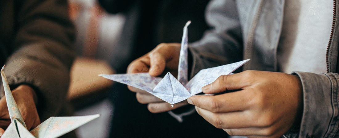 Easy craft using paper A person holding a paper craft crane origami