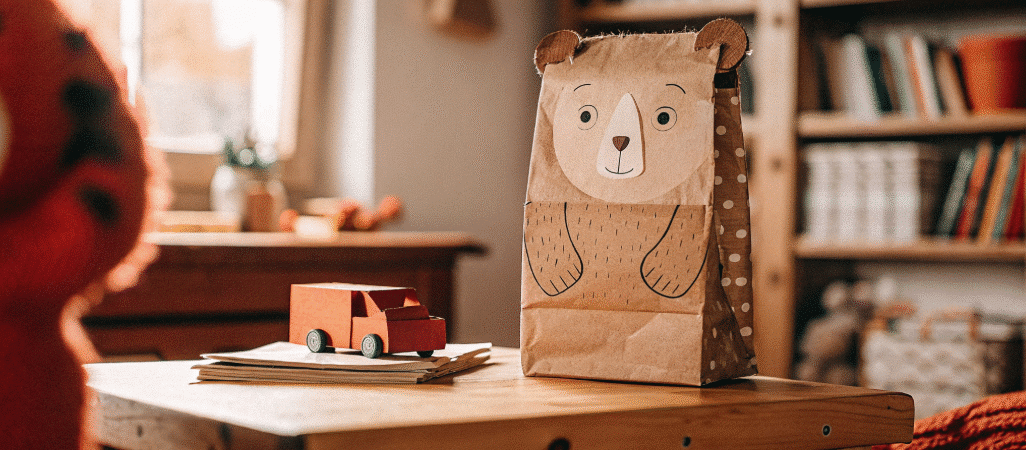 Brown bear paper bag puppet simply paper crafts A brown bear paper bag puppet on atable in a home