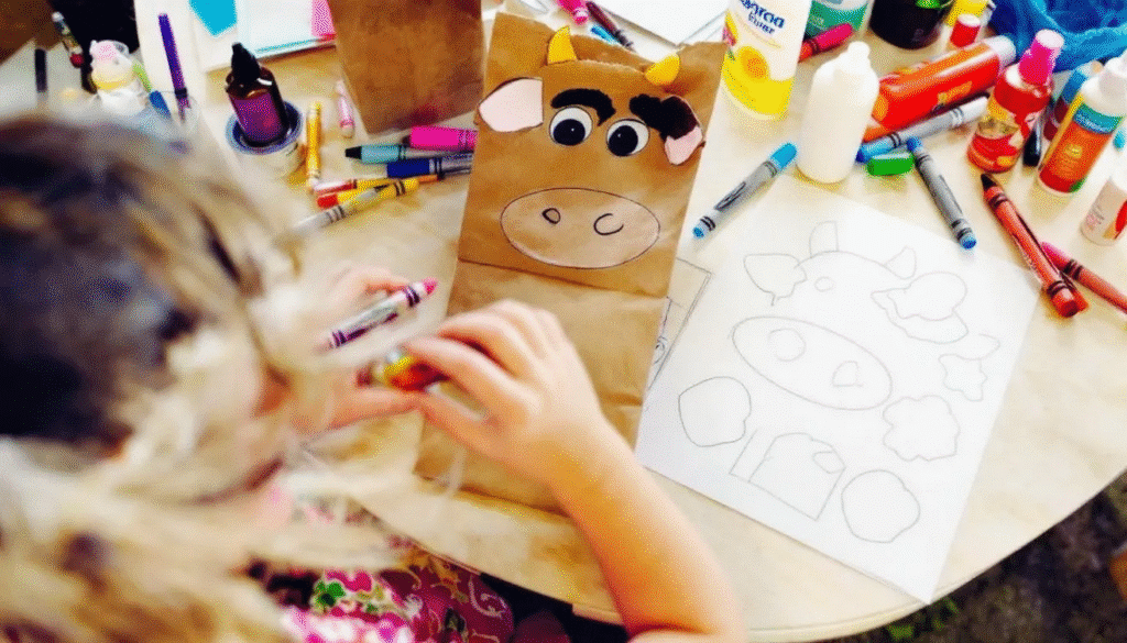 Brown paper bag cow puppet simply paper crafts The image features a cheerful cow paper bag puppet made from a brown paper lunch bag complete with googly eyes a painted nose and floppy ears showcasing a fun and creative craft for kids This adorable paper bag cow is perfect for imaginative play and introduces children to farm animals through an easy and engaging puppet making activity