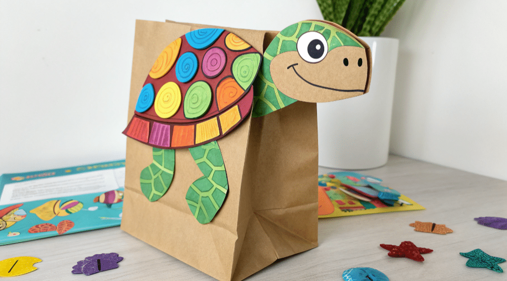 Colorful turtle paper bag puppet simply paper crafts The image depicts a colorful turtle paper bag puppet crafted from a standard brown paper bag adorned with vibrant paper pieces for the shell legs and face This engaging paper bag puppet craft is perfect for kids encouraging imaginative play and fine motor skills development