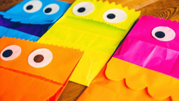 Exploring paper crafts simply paper crafts The image features children engaged in making paper bag puppets showcasing their creativity as they cut decorate and bring their characters to life with construction paper glue and googly eyes This fun paper craft activity encourages imagination and quality time between kids perfect for classrooms or home projects