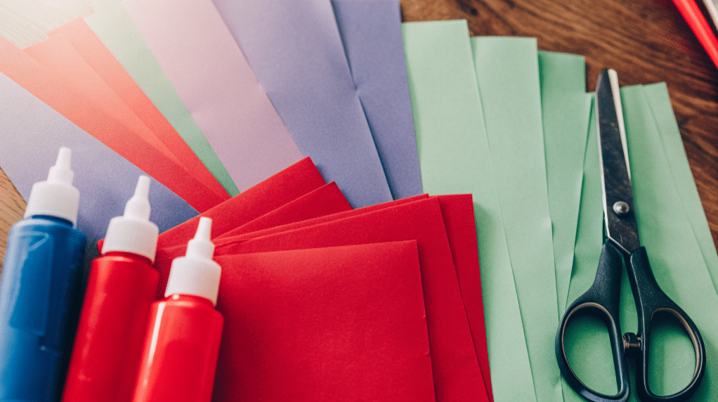 Gather your supplies simply paper crafts A variety of crafting supplies including glue scissors and paper