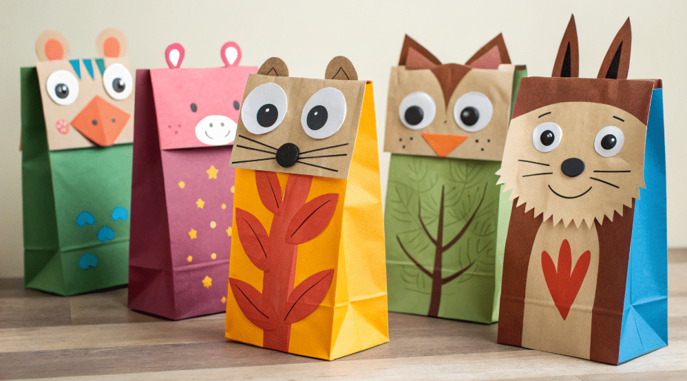 Introduction to paper bag puppets simply paper crafts The image features a variety of colorful paper bag puppets showcasing different designs such as animals and whimsical characters made from simple materials like paper bags and colored paper Each puppet has unique facial features including eyes noses and mouths inviting creativity and imaginative play for kids in both home and classroom settings