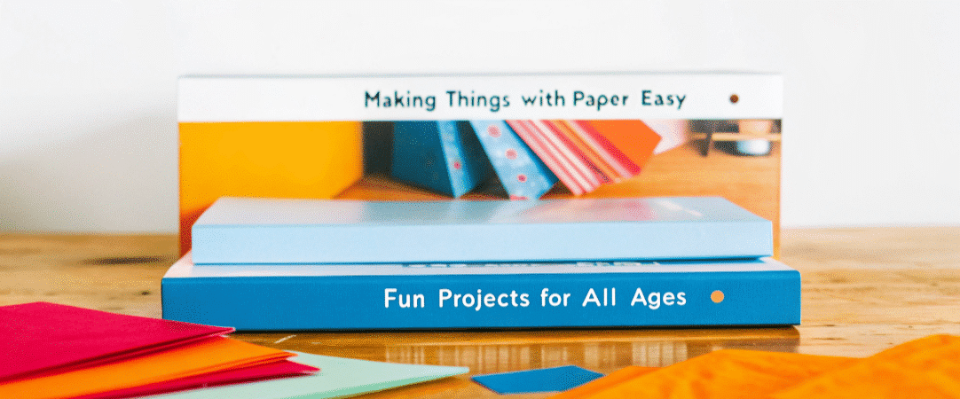 Making things with paper easy simply paper crafts A book titled Making Things with Paper Easy on a table next to colored paper