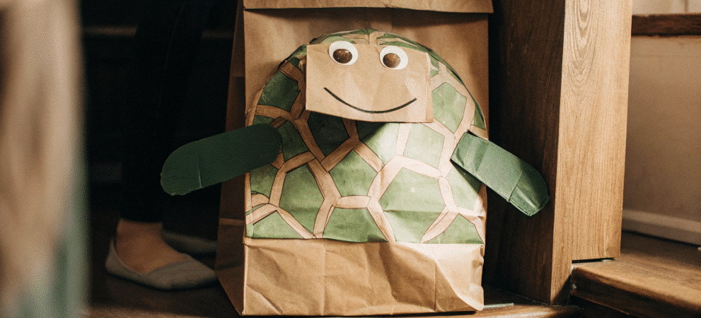 Turtle paper bag puppet simply paper crafts The image features a turtle paper bag puppet made from a brown paper bag