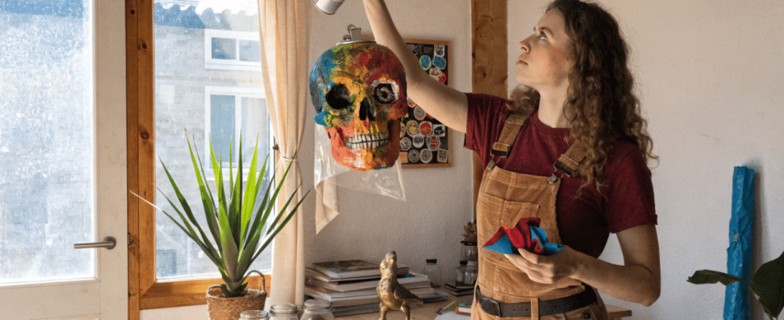 Best spray paint for paper mache A person using spray paint on paper mache