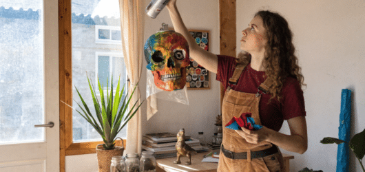 Best spray paint for paper mache A person using spray paint on paper mache