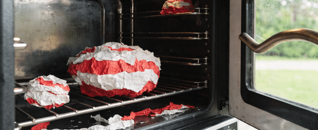 A paper mache in an oven