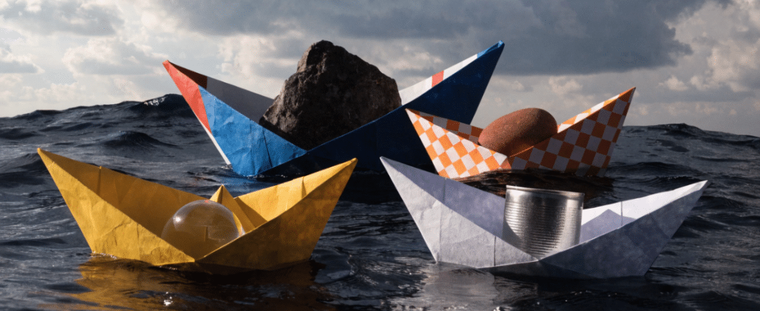 Variouse paper boats in a water