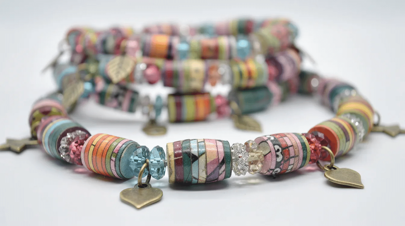 1bfe8a11 158c 49e4 b47d 1d53fcca8463 The image showcases two finished paper bead bracelets made from rolled paper beads and adorned with glass spacer beads and small charms These colorful bracelets perfect for beginners in crafts are designed to be worn on the wrist and display intricate details that highlight the creative process involved in making jewelry from old magazines