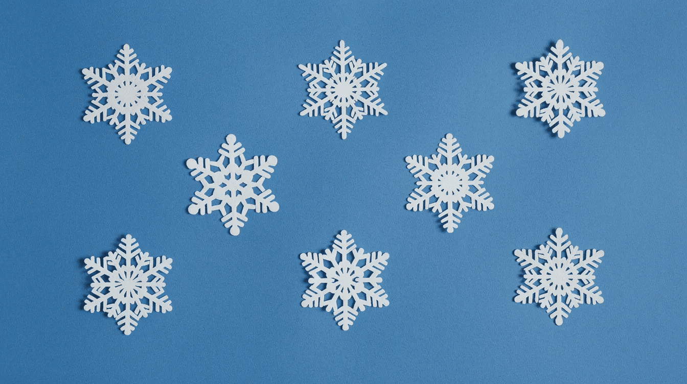 6b854168 006e 4660 bbc0 4e4a9d1bd442 The image features intricately cut white paper snowflakes arranged on a vibrant blue background showcasing various symmetrical patterns created through the kirigami technique This paper folding art highlights the beauty of paper cutting with each snowflake displaying delicate cut lines and folded edges perfect for festive decorations or crafting projects