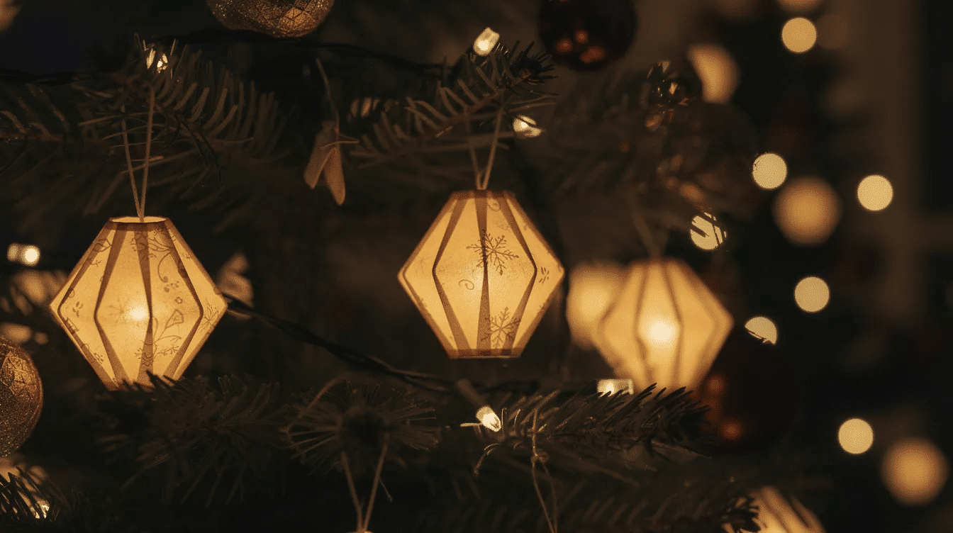 E8826ec0 2eb9 4221 8345 7758221e6e7f The image features small glowing paper lantern ornaments delicately hanging on a beautifully decorated Christmas tree These colorful paper ornaments crafted from scrapbook paper and adorned with cheerful designs add a warm and festive touch to the holiday decoration